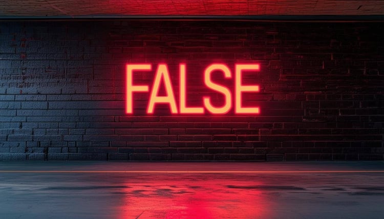 This image shows the word false illuminated in bright neon colors on a wall.