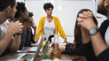 Black Woman Leading A Meeting | OPAAT-SWY | Blog